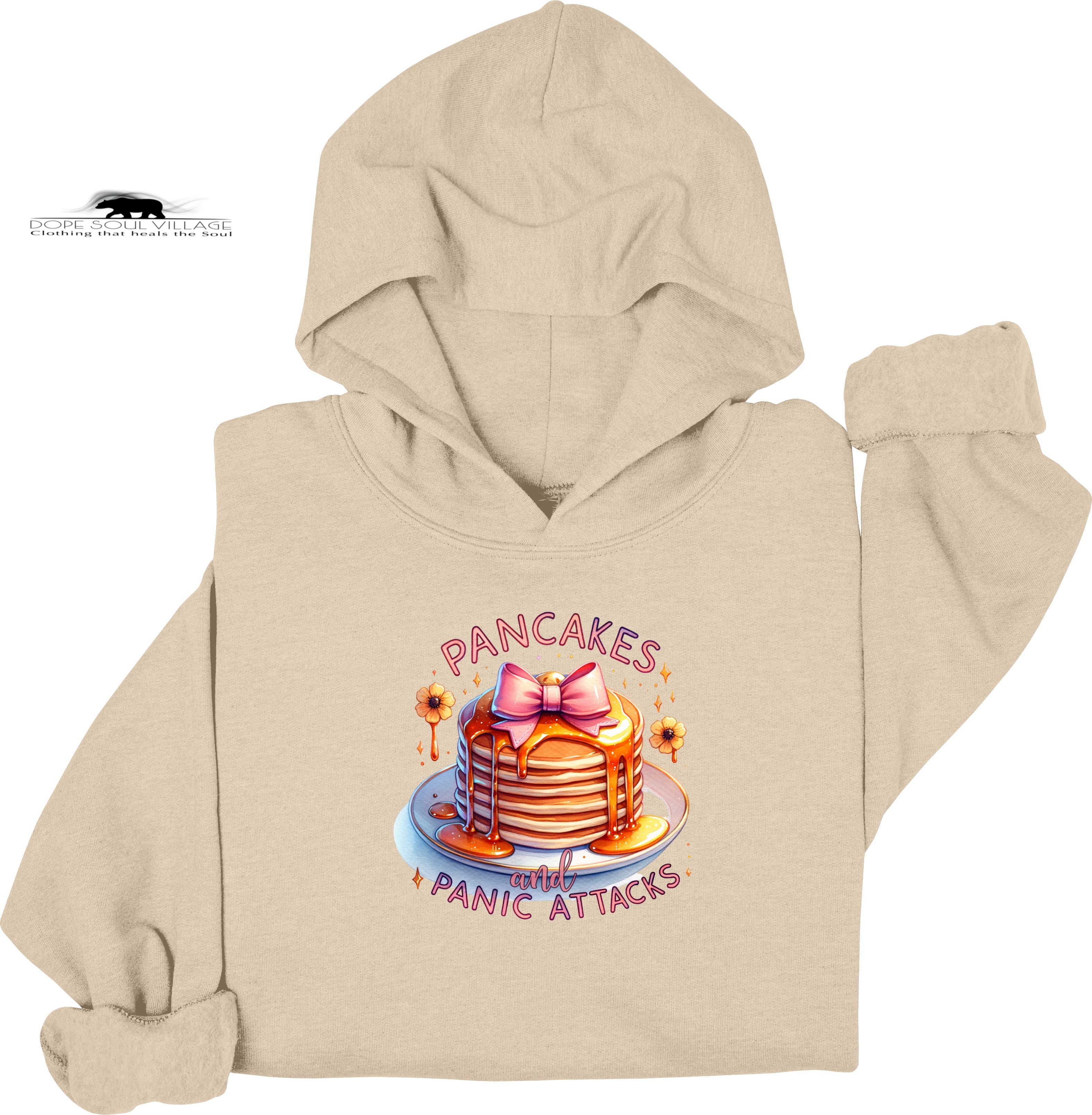 Beige hoodie with a colorful graphic of pancakes and text on a white background