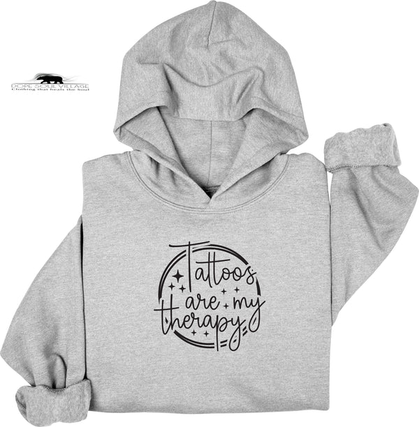 Gray hoodie with 'Tattoos are my therapy' text on a white background