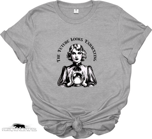 Gray t-shirt with a graphic of a woman and text 'The Future Looks Exhausting' on a white background