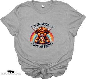 “If I’m Moody, Give Me Foody” t-shirt. Highland cow graphic, sustainable materials. Fun, cheeky tee perfect for animal lovers and ethical fashion fans.