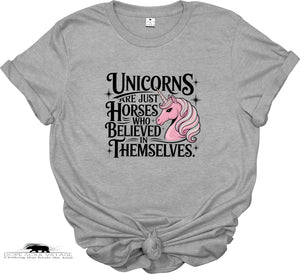 Gray t-shirt with a pink unicorn graphic and text on a white background