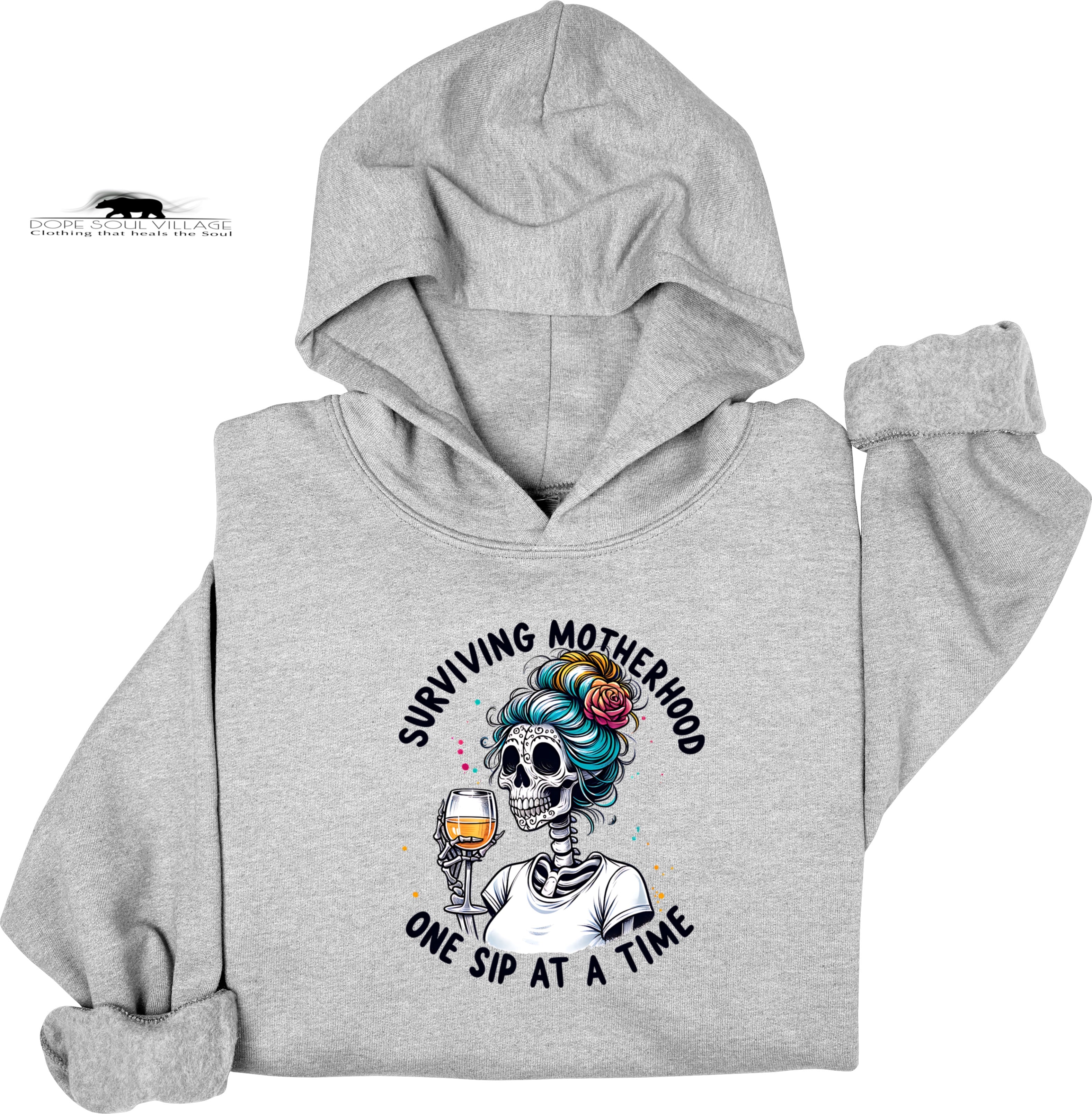 Gray hoodie with a skeleton design and text 'Surviving Motherhood One Sip at a Time' on a white background