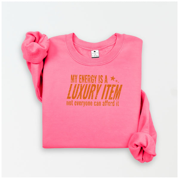 Pink sweatshirt with yellow text on a white background