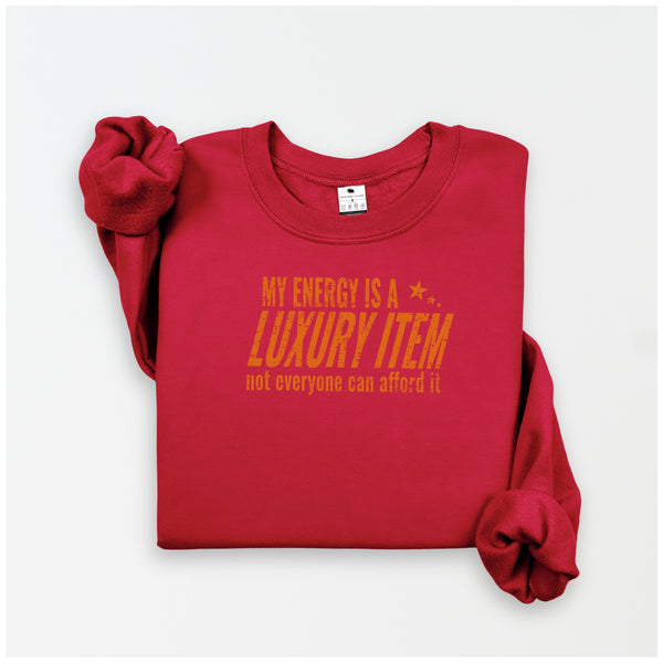 Red sweatshirt with yellow text on a white background