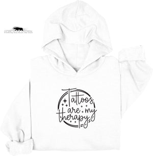 White hoodie with 'Tattoos are my therapy' text design on a white background