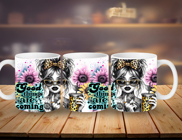 Three mugs with a design of a girl with flowers and text 'Good things are coming' on a wooden surface.