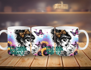 Three mugs with artistic designs and motivational text on a wooden surface.