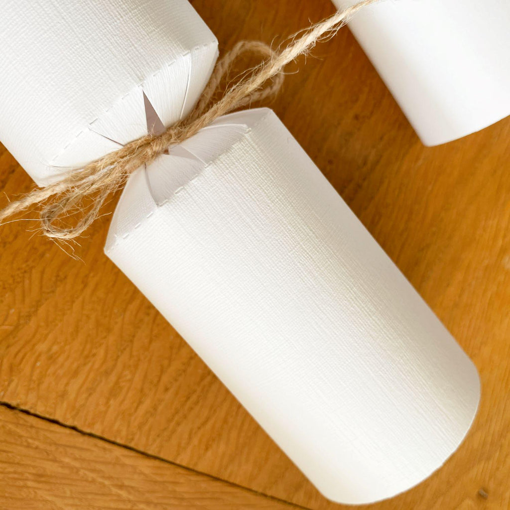 Close up of the white version of the DIY Christmas Cracker Kit, showing the 'linen' texture of the cracker board.