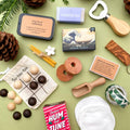 Eco-friendly mini gifts - suitable for Christmas crackers, Advent calendars, stocking fillers and wedding favours - arranged on a green background.