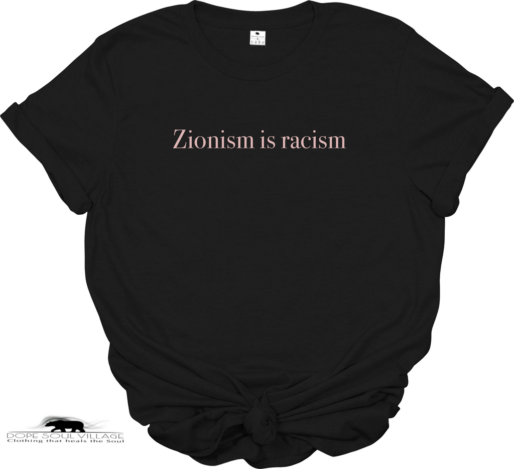 A solid black short-sleeve t-shirt with the text 'Zionism is Racism' printed in a bold white serif font across the chest. The t-shirt is set against a plain white background, available from Dope Soul Village women's marketplace.