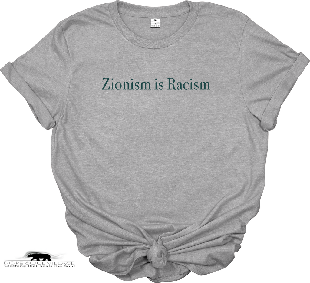A grey short-sleeve t-shirt with the text 'Zionism is Racism' printed in black serif font across the chest. The t-shirt is set against a plain white background, available from Dope Soul Village women's marketplace.